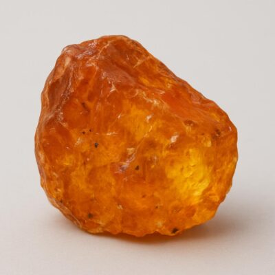 Natural raw amber with rich golden-orange color and unique texture.
